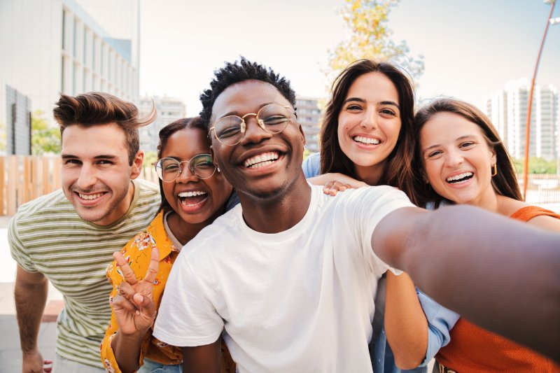 A group of smiling friends taking a selfie